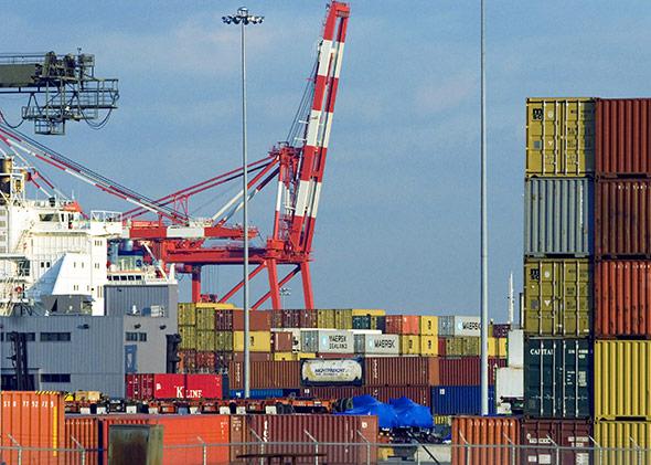Shipping containers lie stacked upon a yard at Port Newark Container Terminal, the third-largest cargo terminal in New York harbor on February 21, 2006 in Newark, New Jersey.